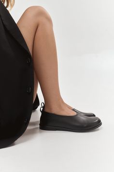 Veronika is a classic round-toe flat design with a modern feel. They are handcrafted from genuine black Italian leather with a wide and comfy toe box.  Memory insoles along the entire length of the shoe are soft and remember the foot's position. Tunit sole is a mixture of leather chips and rubber, it's more wear-resistant than leather and more durable. Also, we use soft natural upper materials that wear well and take the foot's shape. In the photos: Style: Veronika Heel: flat heel Material: black leather PERSONALIZATION: I can offer you a custom-made shoe design, based on existing models. You can request a desirable shape, form, or heel. Just write about what you wish and I will help. Feel free to choose the material and color. If you can't choose from the colors that we have, you can alwa Black Leather Slip-on Ballet Flats, Black Plain Toe Flats For Work, Modern Round Toe Ballet Flats For Everyday, Black Ballet Flats With Rubber Sole For Work, Modern Ballet Flats With Round Toe For Everyday, Black Ballet Flats With Flat Heel For Office, Black Leather Sole Flats For Work, Black Plain Toe Flats For Office, Black Plain Toe Flats For Business