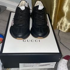 Men’s Rython Gucci Band Sneakers Black In A Size 4 1/2 = Us Size 5. These Sneakers Are Brand New. Gucci Black Sneakers With Contrast Sole, Gucci Black Sneakers With Logo Print, Black Gucci Sneakers With Logo Print, Gucci High-top Leather Sole Sneakers, Gucci High-top Sneakers With Leather Sole, Gucci Leather Sneakers With Abzorb Midsole, Designer Calf Leather Sneakers With Round Toe, Gucci Classic Sneakers For Streetwear, Classic Gucci Sneakers For Streetwear