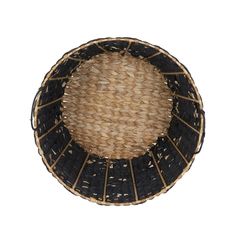 a black and brown basket sitting on top of a white wall