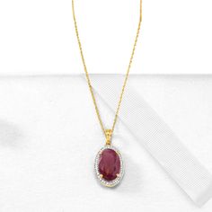 Ross-Simons - 6.30ct Ruby, .14ct t. w. Diamond Pendant Necklace in Gold. 16". Dress to impress. On a grand scale, this pendant necklace boasts a 6.30 carat oval ruby in a .14 ct. t. w. round brilliant-cut diamond halo. Suspends from a 14kt yellow gold rope chain with 2" extender and a lobster clasp. Diamond and ruby pendant necklace. Ruby birthstones are the perfect gift for July birthdays. White Gold Ruby Necklace With Diamond Cut, Fine Jewelry Diamond Necklace With Gemstone For Formal Occasions, Formal Diamond Necklace With Gemstone, Fine Jewelry Ruby Diamond Necklace Brilliant Cut, Gold Ruby Jewelry With Pave Setting, Pear-shaped Diamond Gemstone Necklace, Fine Jewelry Pear-shaped Diamond Necklace With Gemstone, Exquisite Diamond Gemstone Necklace For Anniversary, Formal Ruby Jewelry With Pave Setting