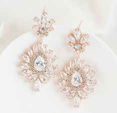 rose gold bridal earrings Elegant Crystal Bridal Earrings For Glamorous Events, Evening Rose Gold Jewelry With Sparkling Stones, Rose Gold Crystal Earrings For Party, Elegant Crystal Earrings For Glamorous Events, Dazzling Rose Gold Diamond Bridal Earrings, Elegant Rose Gold Drop Bridal Earrings, Elegant Rose Gold Bridal Drop Earrings, Dazzling Rose Gold Cubic Zirconia Bridal Earrings, Rose Gold Bridal Earrings With Sparkling Cubic Zirconia