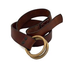 a brown leather belt with two gold rings