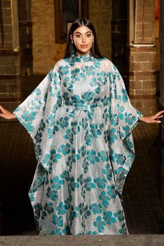 Turn heads in this mesmerizing floral Organza butterfly caftan dress, a true statement piece for the woman who loves to stand out. With its flowing butterfly sleeves and high neck design, this maxi-length beauty is perfect for black-tie events, luxurious resorts, or as an unforgettable wedding guest ensemble. Picture yourself twirling through a garden, or arriving at a fancy gathering with the vibrant floral gloss shimmering in the evening light. This dress is made for moments where elegance mee Organza Butterfly, Traditional Marriage, Evening Light, High Neck Designs, Black Tie Gala, Floral Butterfly, Curvy Plus Size, Caftan Dress, Black Tie Event