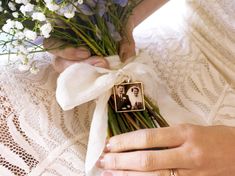 a woman holding a bouquet of flowers in her hands with an old photo attached to it