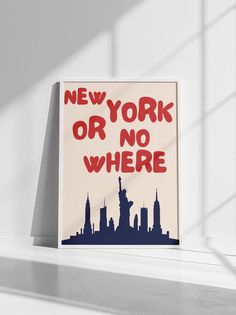 a sign that says new york or no where in front of a white wall with windows