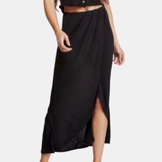 Black Partially Lined With An Elastic Waist, Wrapped Around Skirt, Raw Cut Edges, Asymmetric Hem In Size Xs. Revolve Style No. Free-Wq33. Manufacturer Style No. F036s918. Measurements (Laying Flat): Waist: Approx. 13” (Stretchy) Length: Approx. 42" (Longest Side) Versatile Black Asymmetrical Skirt Bottoms, Casual Vacation Skirt With Asymmetrical Hem, Casual Beach Skirt With High-low Hem, Versatile Maxi Skirt For Beach, Casual Skirt With Asymmetrical Hem For Vacation, Casual High-low Hem Beach Skirt, Casual High-low Hem Skirt For Beach, Casual Beach High-low Hem Skirt, Chic High-low Hem Bottoms For Beach