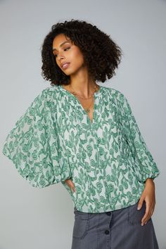 Relaxed meets refined on this flowy top in cool abstract jacquard. Cut for a loose silhouette with a split neckline, the softly gathered style drapes beautifully on the body and finishes with a feminine self-tie. •Split neckline with self-tie •Three-quarter sleeves •Relaxed fit Item number 2330075 100% Polyester Chic Crinkle Texture V-neck Blouse, Green Flowy V-neck Top, Green V-neck Tops With Blouson Sleeves, Green V-neck Blouse With Blouson Sleeves, Elegant Flowy Green Blouse, Elegant Green Flowy Top, Elegant Flowy Green Top, Spring Green Tops With Crinkle Texture, Green Crinkle Texture Tops For Spring