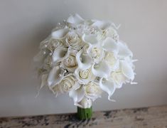 a bouquet of white flowers on a table