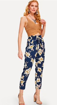 These sassy but sweet floral pants are adorable yet chic. Featuring ruffled, elastic waist and a tapered fit falling just above the ankle. Did we mention front pocket... yes FRONT POCKETS! These pants pair perfectly with a bodysuit suit, cropped top or sweater so be sure and check out our other collections. Complete your look with wedges, heels ors sandals. Made with a polyester blend for comfort and style. Floral Belt, Wedges Heels, Mode Boho, Belted Pants, Straight Trousers, Sweet Floral, Floral Pants, Tapered Pants, Navy Floral