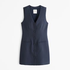 Our vest mini dress in our elevated suiting fabric, featuring button-through detail, non-functional front pockets and v-neckline. Striped V-neck Mini Dress For Work, Female Features, Pinstriping Designs, Suiting Fabric, American Apparel, Abercrombie Fitch, Gender Female, Jumpsuit Dress, New Dress