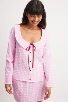 Checked Tie Front Top Pink Long Sleeve Blouse For Loungewear, Pink Long Sleeve Feminine Top, Feminine Pink Long Sleeve Top, Pink Button-up Blouse For Loungewear, Pink Long Sleeve Cotton Blouse, Pink Long Sleeve Blouse For Daywear, Pink Long Sleeve Top For Daywear, Pink Long Sleeve Loungewear Tops, Chic Long Sleeve Loungewear Blouse