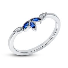 a white gold ring with blue sapphire and diamonds