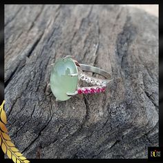 "Prehnite is a captivating gemstone with a soothing green color. Revered for its calming energy and ethereal glow, it promotes harmony and personal growth. Adorn yourself with nature's serene embrace. * Gemstone: Prehnite & Cubic Zirconia * Gem color: Green, White & Pink * Size: 10x14 mm * Weight: 5.45 ct. * Metal Purity: 925 Sterling Silver  * Usage: For Girls & women Jewels as Unique as You Are 💎💖 Keep Noted- All the products' photographs are taken under natural light or a flashlight. However, the color you see in the picture may be a little different compared with the real product. We always try our best to capture the photos so that you can get a clear view of the product ♥ If you require any other assistance, I would be more than happy to help you. ♥ If You Like Our Product, Please Gemstone Cabochons, Jewelry Gemstone, Ring Handmade, Rings Statement, Flashlight, 925 Sterling Silver Ring, Personal Growth, Green Color, Sterling Silver Ring