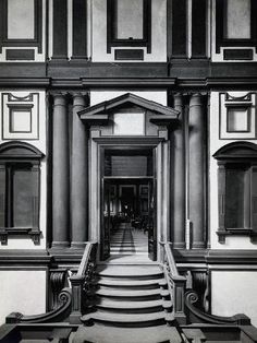 an old building with stairs leading up to it