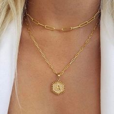 Show off your personalized style with this lovely Paperclip Hexagon Monogram Layer Necklace. This piece is a cool twist on the monogram trend, allowing you to flaunt your initials in an edgy yet chic way. Crafted from stainless steel and dipped in 18 karat gold, this necklace isn't just about looks - it's built to last. The hexagonal pendant adds a geometric touch, while the paperclip chains add a dash of fun to your ensemble. And with the entire alphabet available, you can make this piece uniqu Layered Gold Necklaces Paperclip, Initial Necklace Layering, Paperclip Necklace Layering, 18k Gold Necklace, Layered Necklace Set, Necklace Layering, Layer Necklace, Jewellery Ideas, Gold Necklace Layered