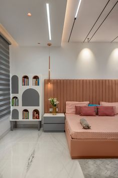 a bed sitting in the middle of a bedroom next to a book shelf