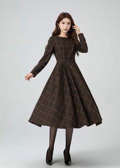 This garment blends timeless elegance with contemporary flair. The cinched waist and flared shape accentuates the waist, and there are pleated details at the waist. The plaid design adds a touch of vintage and sophistication.A must-have for this autumn and winter. DETAIL * 30% wool, 30% fiber, 40% polyester * fully satiny lining, more nice to the touch body * Round neckline * Long sleeves dress * Two side seam pockets * Back zipper closure * Fit and flare dress * Midi wool dress * Plaid wool dre Long Plaid Dress, Thrift Board, Custom Dress, Dress Winter, Thrift Finds, Check Dress, Dress Inspo, Sleeves Dress, Winter Dress