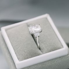 an engagement ring is sitting in a box