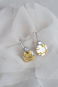 With the look of luxury fine diamonds, the sparkle and presence of the Astor luxury earrings are something to behold.  Small brilliant cut crystals cascade along the French hook style earpiece with a small brilliant cut crystal settling on top of a magnificent sparkling canary yellow asscher cut crystal. Beautifully realistic and elegant enough for everyday wear and also for evenings out and special occasions. The Asscher cut is a unique shape with prismatic brilliance and a rectangular-faceted Canary Yellow Diamonds, Earrings Luxury, Luxury Earrings, Tanzanite Ring, Sparkly Earrings, Asscher Cut, Canary Yellow, Earrings Crystal, Square Diamond