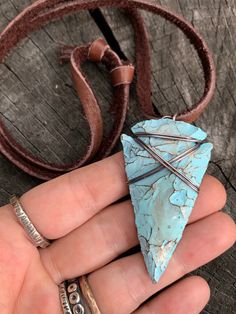 "This is my fresh spin on a wire wrapped classic. Arrowheads have been worn as jewelry for ages and are a recognizable symbol of alertness, walking the straight and narrow & strength. The arrowhead I used is made of jasper stone and is a hand knapped modern replica. It was made in the same tradition and with the same primitive techniques that early man used. I added a lovely pale turquoise & gold highlight patina then wire wrapped it with blackened (oxidized) copper wire. This is a great Adjustable Southwestern Hand Wrapped Jewelry, Southwestern Adjustable Hand Wrapped Jewelry, Southwestern Hand Wrapped Adjustable Jewelry, Adjustable Southwestern Style Hand Wrapped Jewelry, Rustic Patina Jewelry For Festival, Bohemian Hand Forged Adjustable Necklaces, Bohemian Adjustable Hand Forged Necklaces, Artisan Necklace With Adjustable Patina, Adjustable Bohemian Hand Forged Necklaces