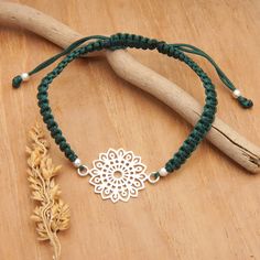 Attract balance to your life with this elegant accessory from Bali, inspired by mandalas and their relaxing aura. Sukartini's macrame bracelet features a shiny sterling silver pendant in a classic floral shape, whose sweet design will captivate everyone. The cord chain, in a charming green hue, features polished beads and a sliding knot that allows you to adjust the length to your liking. Green Macrame, Macrame Pendant, Macrame Bracelet, Sliding Knot, Macrame Bracelets, Elegant Accessories, Pendant Bracelet, Sterling Silver Pendant, Sterling Silver Pendants