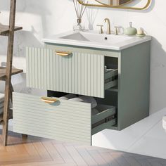 a bathroom vanity with two drawers and a mirror on the wall above it, next to a ladder