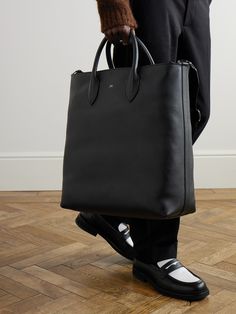 DESIGNED BY MR PORTER. Mr P.'s tote bag is a smart, practical choice for the office. Sized for your laptop, notebook and paperback, it's made from full-grain leather and has an adjustable shoulder strap for easy carrying. Tuck your business cards and chargers in the internal zipped pocket. Designer Tote Briefcase For Business, Designer Business Briefcase Tote, Designer Business Laptop Bag Tote, Business Briefcase With Dust Bag, Tote Style, Designer Briefcase With Removable Pouch For Work, Modern Leather Briefcase With Dust Bag, Modern Leather Briefcase, Modern Smooth Grain Tote Briefcase, Timeless Business Briefcase With Removable Pouch