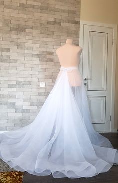 Diamond shaped asymmetric organza wedding train with horsehair hem - a truly elegant and unique adding to your bridal gown. Only high quality fabrics and high finishing used for making the wedding skirt as neat as it can be. the length is customizable. For more wedding skirts, please access https://www.etsy.com/shop/LidiasBoutiqueDesign?ref=seller-platform-mcnav&section_id=23168823. For more wedding tops and boleros, please access https://www.etsy.com/shop/LidiasBoutiqueDesign?ref=seller-pla Long Wedding Train, Wedding Skirt Separate, Wedding Overskirt, Bridal Skirt Separate, Wedding Skirts, Wedding Tops, Wedding Train, Train Skirt, Wedding Separates