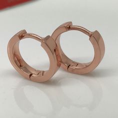 14 gauge hoop earrings hand crafted from sterling silver and plated in rose gold. Sold as a single earring or as a pair. Also available in 20 gauge normal ear posts. SPECIFICATION Base metal: Recyclable fine 925 Sterling Silver Decorative outer plating: rose gold Inner diameter: 13mm, size L Width: 3.5mm Ear post gauge: 14 gauge Measurements are an approximation Cartilage Hoop Earrings, Earrings Dragon, Gold Gauges, Hoop Earrings Large, Gauge Earrings, Plug Earrings, Cartilage Earrings Hoop, Cartilage Hoop, Earrings Rose Gold