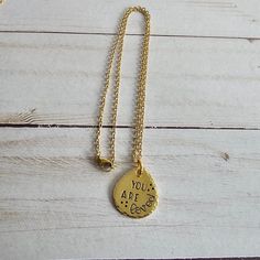 This hand stamped brass necklace will make a great gift for any woman in your life. Choose from 4 different sayings, for the perfect gift for anyone! Choose your saying from the drop down menu on the listing.The brass charm is approx 1" x 3/4" and is attached to an 18" gold plated stainless steel chain. The charm has a lightly brushed finish, hammered edges, and is hand stamped to order, using the quote that you selected. The stamped impression is then filled in with a long lasting black ink.If Handmade Brass, Brass Charms, Brass Necklace, Just Breathe, Brass Jewelry, Drop Necklace, Trendy Jewelry, Steel Chain, Stainless Steel Chain