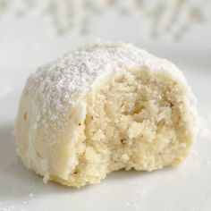 a powdered sugar ball on a white plate