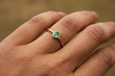 18k Ring With Emerald | Etsy Everyday Emerald Ring In Yellow Gold, Everyday Green Emerald Ring With Bezel Setting, Minimalist Green Emerald Wedding Ring, Elegant Green Emerald Ring For Everyday, Minimalist Emerald Ring For Formal Occasions, Minimalist Green Oval Emerald Ring, Minimalist Oval Green Emerald Ring, Everyday Green Emerald Ring May Birthstone, Ring With Emerald