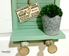 a potted plant sitting on top of a green shelf