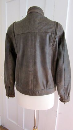 "1980s Motorcycle Leather Bomber Jacket 4 outside pocket, 2 with zippers , 2 with snaps. 1 inside pocket with a snap. Nylon lining 4 zip air vents,2 in front, 2 in back, starting at the shoulders. 2 snaps at neck, 1 just below neck, and 3 snaps at waist. Row of snaps inside, I think it originally came with an insulated lining. You might be able to find one. Size - 40 = US Woman's 10 Bust - 42\" Waist - 42\" Hips - 39\" Arm - 24\" Shoulder - 16.5\" Length - 23\" Sleeve Zippers - 5.5\" Condition - Retro Biker Jacket For Fall Outdoor, Retro Biker Jacket For Fall, Retro Fall Biker Jacket For Outdoor, Fitted Leather Jacket With Pockets For Outdoor, Vintage Outdoor Biker Jacket With Zipper Closure, Vintage Biker Jacket With Zipper Closure For Outdoor, Vintage Biker Jacket With Zipper For Outdoor, Fitted Biker Jacket With Pockets For Outdoor, Vintage Outerwear With Ykk Zipper For Fall