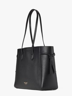 meet our knott tote. you'll notice it has clever cinched knotted sides but that's not the only reason it earned its name. a snap-tab slip pocket organizes all the little things. there's room enough to fit your essentials even a 13 laptop. it's the bag that ties it all together. | Kate Spade Knott Large Tote, Black Kate Spade Knott, Kate Spade Outlet, Black Leather Bag, Large Leather Tote, Gold Bag, Black Leather Bags, Boot Bag, Kate Spade Handbags, The Little Things