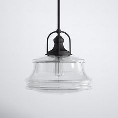 a clear glass light fixture hanging from a ceiling