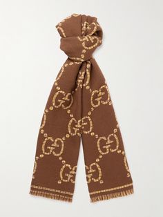 Gucci's scarf is intarsia-knitted with an oversized version of the iconic 'GG' pattern that dates back to the 1930s. It's been made in Italy from insulating wool and finished with fringed ends. Gucci Bee Scarf, Designer Gucci Winter Scarves, Designer Gucci Scarves For Winter, Gucci Designer Winter Scarves, Gucci Luxury Winter Scarves, Gucci Luxury Winter Scarf, Luxury Gucci Scarf For Winter, Luxury Gucci Scarves For Fall, Luxury Gucci Winter Scarves