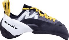 a pair of climbing shoes with yellow laces