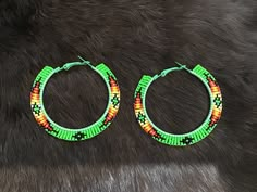 Authentic Beautiful Native American Indian Jewelry Navajo Zuni Hand Beaded 2.25 inch Hoop Earrings Great for a  Gift❤️ Handcrafted by Navajo Artist H. Crosby  Present in virtually every Native American tribe, the feather symbol is universally recognized as a representation of trust, strength, wisdom, freedom, and honor. Incorporated into many sacred pieces of Native American wear, the feather is easily one of the most respected symbols. Handmade Southwestern Green Earrings, Southwestern Green Earrings With Colorful Beads, Southwestern Style Green Earrings With Colorful Beads, Handmade Southwestern Green Beaded Earrings, Southwestern Green Beaded Earrings For Gift, Green Southwestern Beaded Earrings Gift, Green Southwestern Beaded Earrings For Gift, Bohemian Green Beaded Small Hoop Earrings, Bohemian Green Small Hoop Beaded Earrings