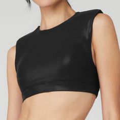 a woman wearing a black crop top