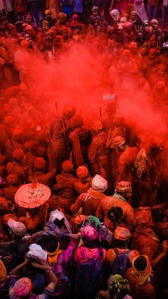 people are throwing colored powder on each other