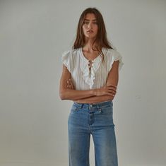 A sweet little top ready to take you from summer to fall. 100% cotton Care: hand wash / hang dry Relaxed Washed Tops For Summer, Relaxed Summer Tops With Frayed Hem, Summer Tops With Relaxed Fit, Chic Everyday Top With Frayed Hem, Chic Relaxed Fit Top With Frayed Hem, Chic Tops With Frayed Hem And Relaxed Fit, Chic Everyday Tops With Frayed Hem, Chic Tops With Frayed Hem For Everyday, Light Wash Cotton Blouse With Ruffles