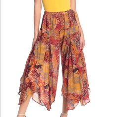 New Wide Leg Comfy Cotton Wide Leg Pants . Looks Like A Skirt Or Gaucho Pants. Sheer But Not See Though Cotton. Very Pretty Pants. Pockets And Side Tie. See Pics. Retails $98 Multicolor Bottoms For Fall Vacation, Multicolor Fall Vacation Bottoms, Orange Wide-leg Summer Bottoms, Orange Wide-leg Summer Pants, Orange Wide-leg Pants For Summer, Summer Orange Wide-leg Pants, Chic Orange Pants For Vacation, Bohemian Orange Bottoms For Fall, Stretch Orange Bottoms For Vacation