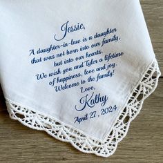 an embroidered handkerchief with the words jesus, daughter - in - law is a daughter that was not born into our family