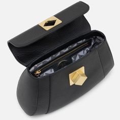 The Arcadia Bernadette is a satchel with geometric and sharp lines. It’s elegant and classy thanks to the macro front turn lock. It comes with a sholder strap for an extra comfort. Italian Leather Handbags, Lock It, Italian Leather, Leather Handbags, Satchel, Things To Come, Turn Ons, Wallet, Handbags