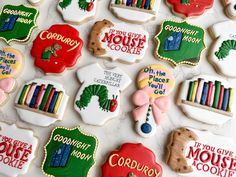 decorated cookies are arranged on a table with the words i love you more than books