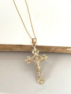 Item Specifications Handmade Yellow Gold A timeless symbol of faith and redemption. This crucifix cross is beautifully crafted in 14k yellow gold.  Whether for a baptism, confirmation, wedding, or as a thoughtful gesture of sympathy and support, our crucifix cross makes a meaningful and cherished gift for loved ones.  Cross Measurements : 45mm (With Bail) Height x 22.50mm Width Metal : 14k yellow gold Chain Style: 0.75mm Cable 16" Long Closure: Spring Ring Country Of Manufacturing------------- * Gold Cross Necklace Wedding, Christian Bride Gold Jewellery, Elegant Crucifix Cross Necklace For First Communion, Elegant White Gold Crucifix Jewelry, Elegant Cross Charms For First Communion, Classic 14k Gold Crucifix Jewelry And Charms, Yellow Gold Cross Pendant For Wedding, Elegant Cross Jewelry And Charms For First Communion, Yellow Gold Cross Wedding Jewelry And Charms