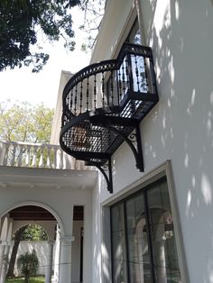 an iron balcony railing on the outside of a house