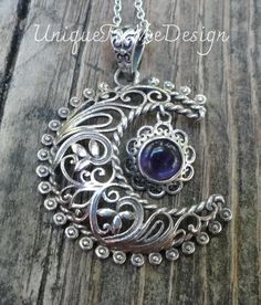 "Natural Purple Amethyst Gemstone Filigree Crescent Moon pendant on an 18\" Sterling Silver chain.   Featured in this listing is a handmade, Sterling Silver, Natural stone pendant.  This pendant features a round purple amethyst gemstone that dangles between a highly detailed filigree Crescent Moon made of all Sterling Silver with a detailed bail and featured on a 18\" Sterling Silver Chain.  Gemstone:  Purple Amethyst (8mm) Metal: Sterling Silver  Dimensions of Pendant: 1 3/4\" x 1 1/4\"  🌙Be s Sterling Silver Crescent Spiritual Jewelry, Spiritual Sterling Silver Crescent Jewelry, Spiritual Crescent Sterling Silver Jewelry, Bohemian Sterling Silver Gemstones, Bohemian Moon Shaped Birthstone Jewelry, Ornate Sterling Silver Purple Jewelry, Mystical Sterling Silver Jewelry Stamped 925, Ornate Purple Sterling Silver Jewelry, Bohemian Amethyst Moon Charm Jewelry