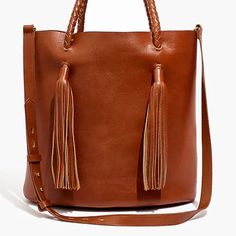 Madewell Italian Leather New Without Tags Made Of Rich Leather, This Versatile Bucket Bag Can Be Carried By The Tasseled Woven Top Handles Or The Removable Crossbody Strap. Plus It's Roomy Enough For All Your Have-To-Have-Its Like A Water Bottle, Cardigan, Paperback And Chargers. Leather. Interior Pocket. 8 1/4" Handle Drop. 12 1/4"H X 11"W X 5 1/2"D. Madewell Tote, Madewell Transport Tote, Madewell Bags, English Saddle, Leather Camera Bag, Chain Crossbody Bag, Leather Bucket Bag, Woven Top, Black Cross Body Bag